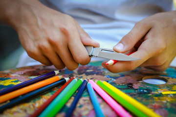 Obraz premium colorful pencils on a paint palette