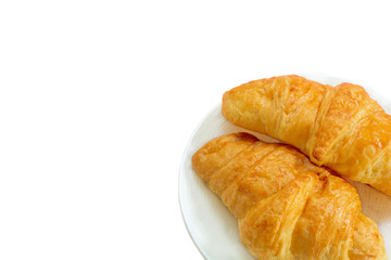 Two croissants on white dish with copy space for your text isolated.