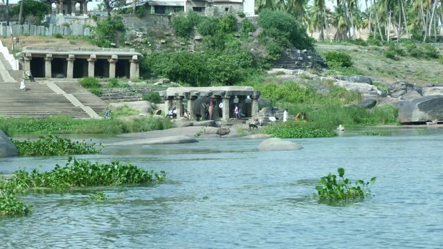 Stone structure of ancient temple near river in Hampi, Karnataka