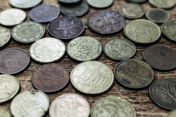 coins old rusty brass euro pile pack heap stack on a wooden background finance economy investment savings concept mock up selective focus close up