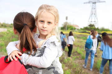 Mother with little daughter among group of illegal migrants escaping from their country