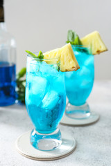 Glass of Blue Lagoon cocktail on table