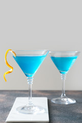 Glasses of Blue Lagoon cocktail on table