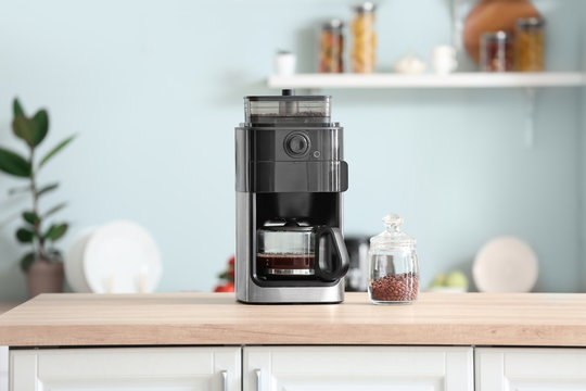 Modern Coffee Machine On Table In Kitchen