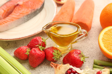 Different healthy food on grey table