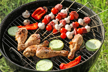 Cooking of tasty food on barbecue grill outdoors, closeup