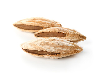 Unpeeled almond nuts on white background