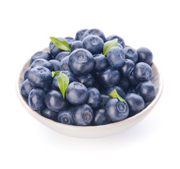 Plate with ripe blueberry on white background