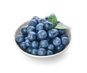 Plate with ripe blueberry on white background
