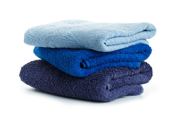Stack of clean coloful  soft towels on white background