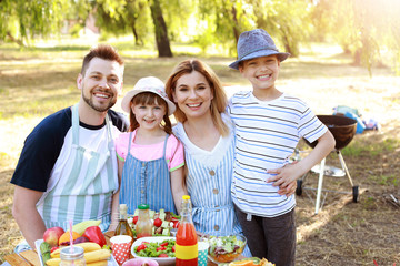 Happy family having picnic on summer day