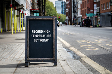 Record high temperature set today. Foldable advertising poster on the street