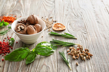 Different herbs and spices on wooden background