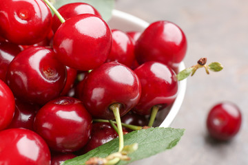 Tasty ripe cherry in bowl, closeup