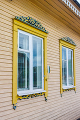 Fototapeta premium Wooden Windows in old houses in the Russian North. Nice shots. Carving. Traditional wood housing
