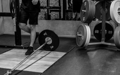 Asian men exercise at the gym