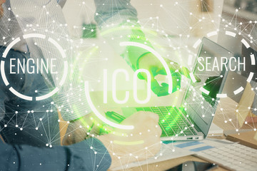 Crypto currency theme hologram with businessman working on computer on background. Concept of...