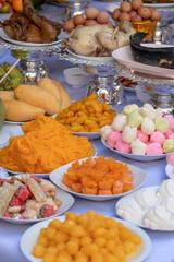 Sacrificial offering food for pray to god and memorial to ancestor, Bangkok, Thailand. Traditional offerings to gods with food, vegetable and fruit for the gods of Thai culture