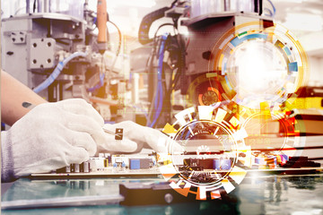 The hands of the man use the handle to hold the electronic part.