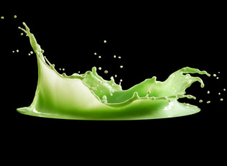 green paint splash isolated on black background