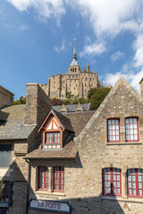 Fototapeta premium Ancient buildings of the old town on the famous Mont Saint Michel island in France