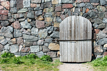 Wooden door and stone wall.