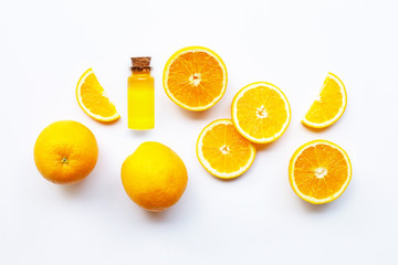 Orange fruits with citrus oil. Natural vitamin C on white background.