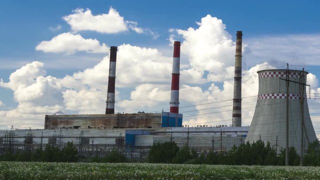 City power plant towers, sunny day, time lapse.