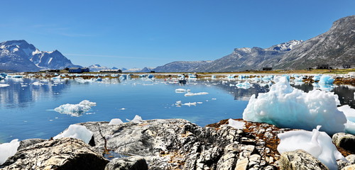 Abandoned fishing village, landscape Greenland, beautiful Nuuk fjord, ocean, iceberg with mountains...