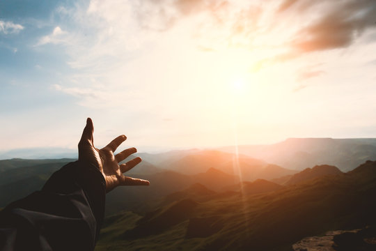 Hand touching Mountains sunset landscape emotional Travel Lifestyle wanderlust concept adventure summer vacations outdoor calm harmony with nature