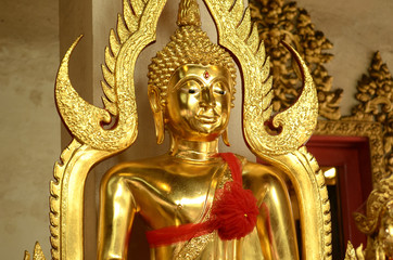 Fototapeta na wymiar Buddha statue,Buddha face,Buddha image,Gilded buddhist figure Buddhist image covering gold leaf.