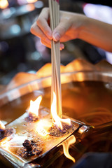 Girl light the incense sticks