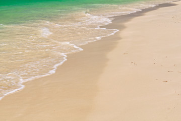 Gentle ocean waves wash the beach - Jurien Bay, WA, Australia