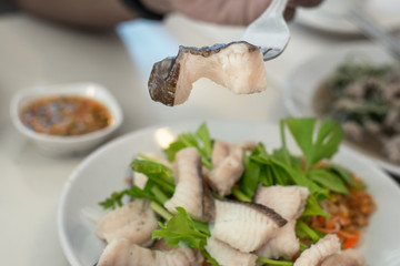 Boiled cat fish in the fork