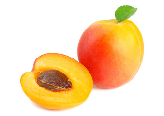 apricot fruits with slices and green leaf isolated on white background