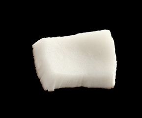 Close up view of coconut piece isolated on black background