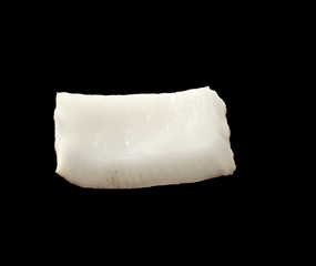 Close up view of coconut piece isolated on black background