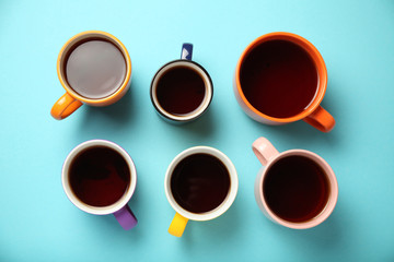 Black tea (coffee) in bright cups, office break, team building.