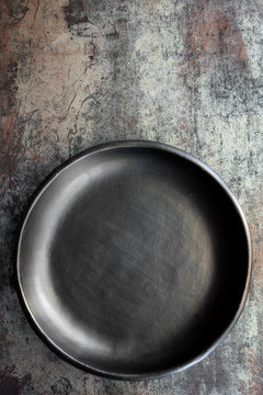 Empty Rustic Black Plate on Slate Background Top View