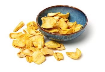 Close up of a pile of dried jackfruit chips isolated on white background