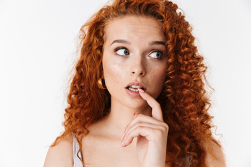 Portrait of an attractive woman with long curly red hair