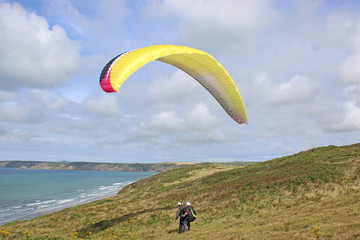 Tandem paraglider launching at Newgale, Wales