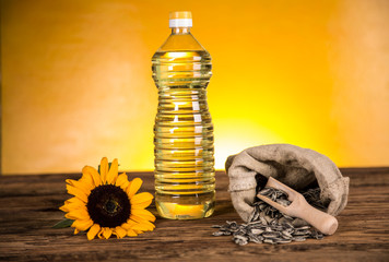 Sunflower oil in a bottle and sunflower seeds and sunflower