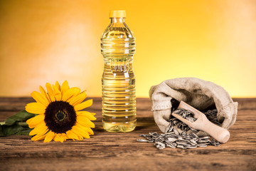 Sunflower oil in a bottle and sunflower seeds and sunflower