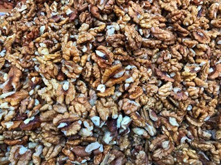 Stack of shelled walnuts ready for sale at farmers market 