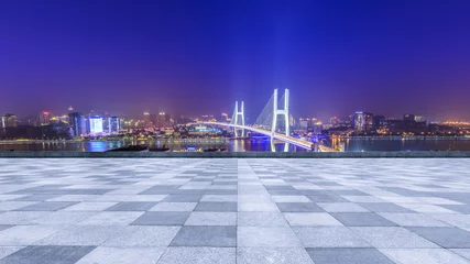 Papier Peint photo autocollant Pont de Nanpu Empty square floor and bridge buildings at night in Shanghai,China
