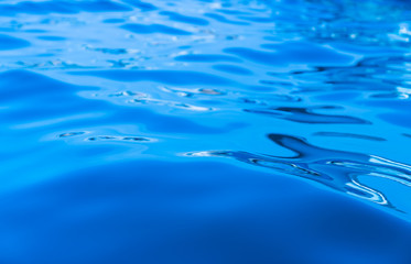 Obraz premium Calm swirlling blue water surface