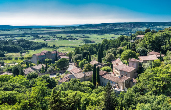 France, Vaucluse, plunging view over the perched village of Seguret (Plus Beau Village de France - Most Beautiful Village of France) (Camino de Santiago) and the Rhone valley