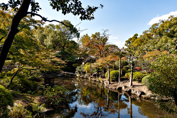 Fototapeta na wymiar Autumn color at a Japanese garden in Osaka, Japan