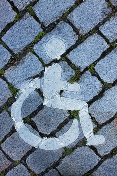 France, pictogram on a parking spot reserved to disabled drivers